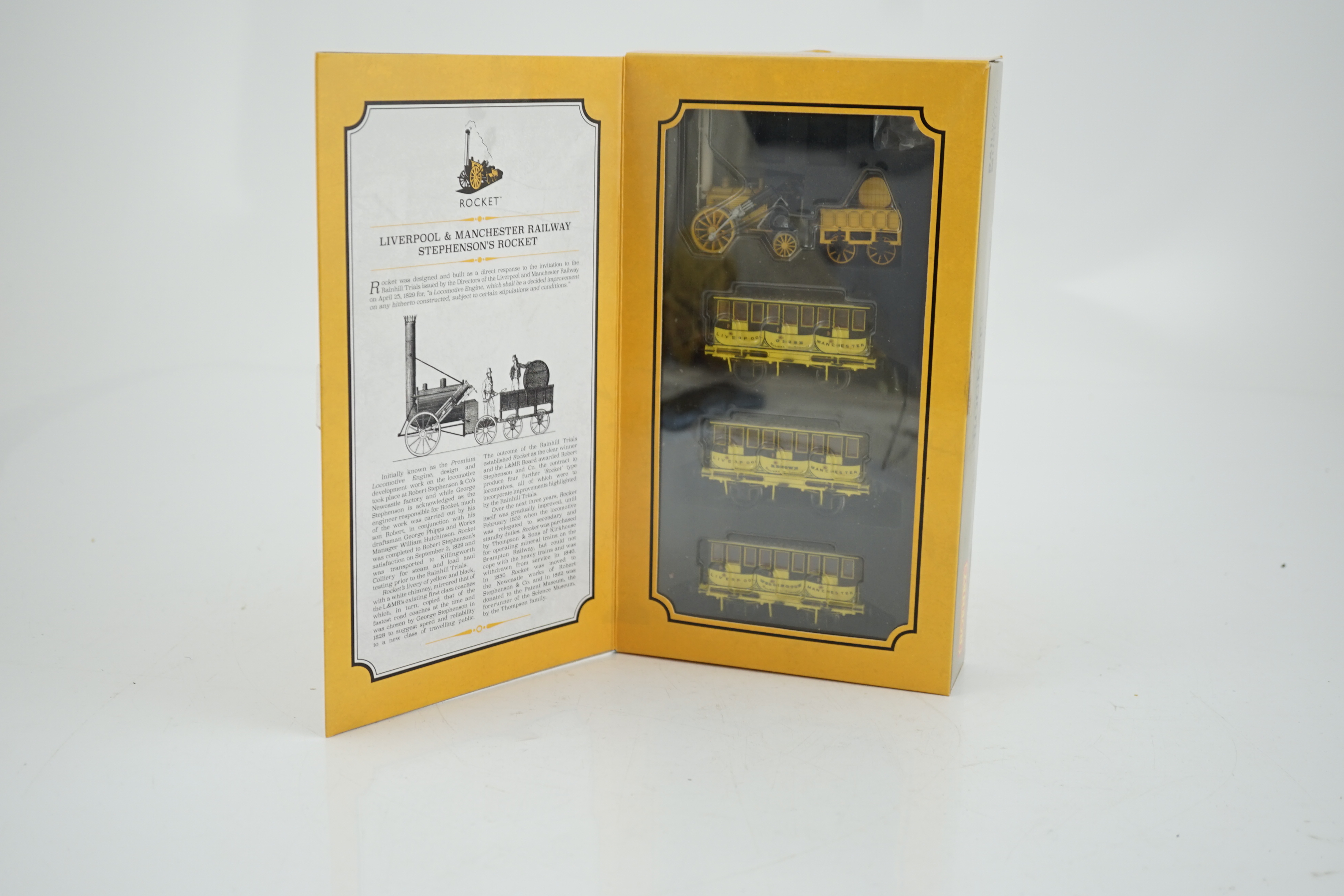 A Hornby Hobbies 00 gauge Rocket train pack (R3810), comprising of Stephenson’s locomotive Rocket and three Liverpool and Manchester 4-wheel coaches